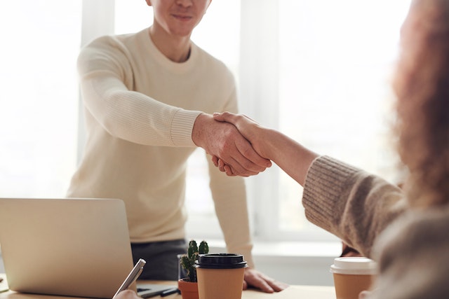 two-people-sharing-a-handshake